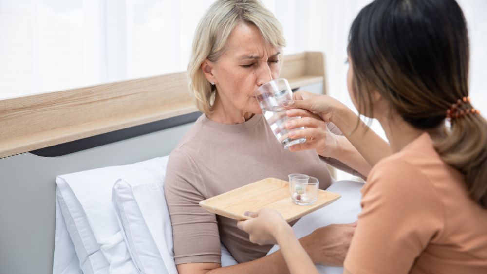 Patient drinking water while resting.